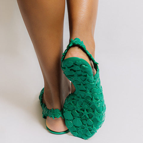 Women wearing green summer sandals